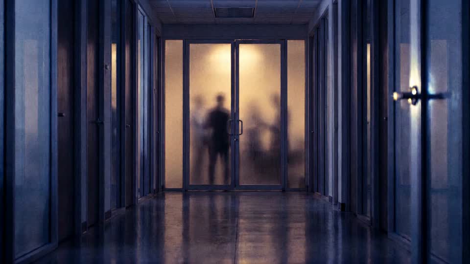 The door opening into a pantry where colleagues are laughing together